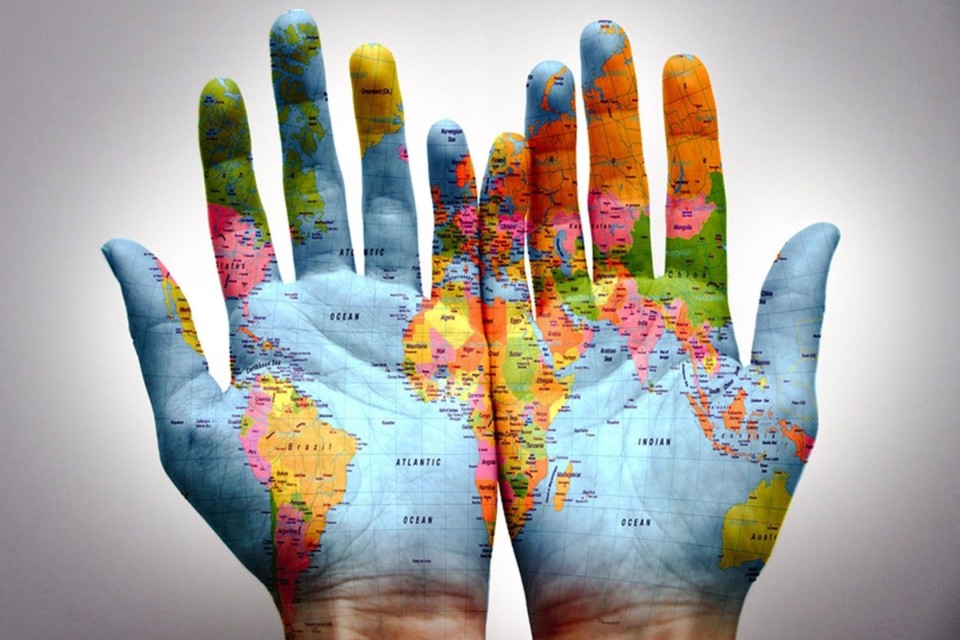 world-map-on-hands-960x640